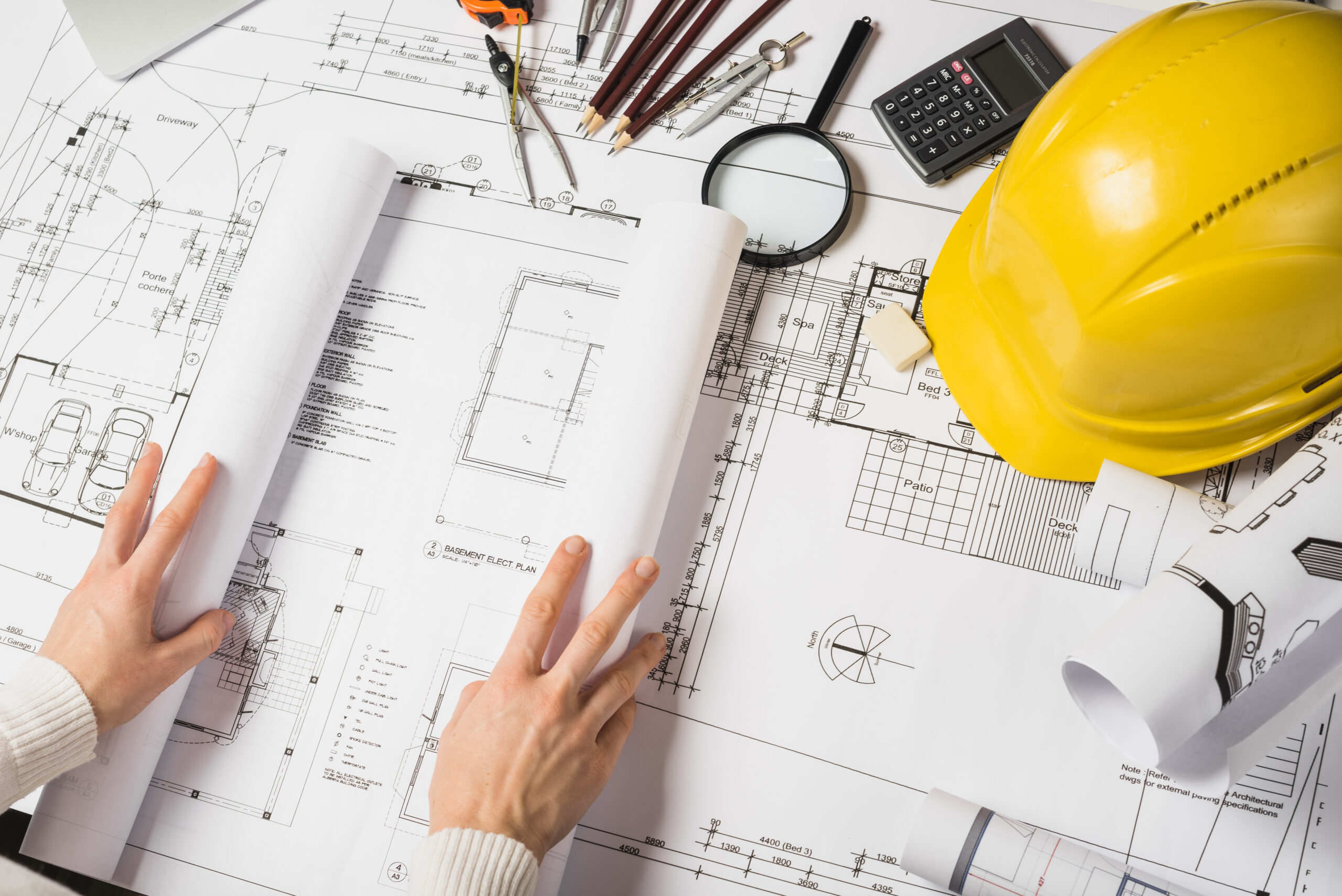 Construction blueprint and helmet